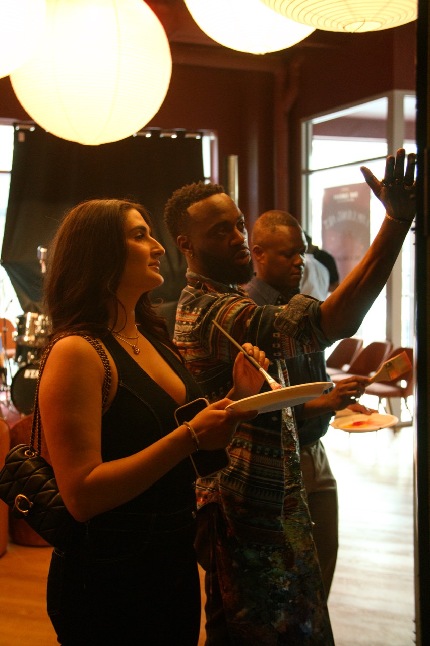 Guests painting together on the interactive canvas