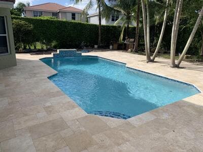 big residential pool with tile steps on the corner