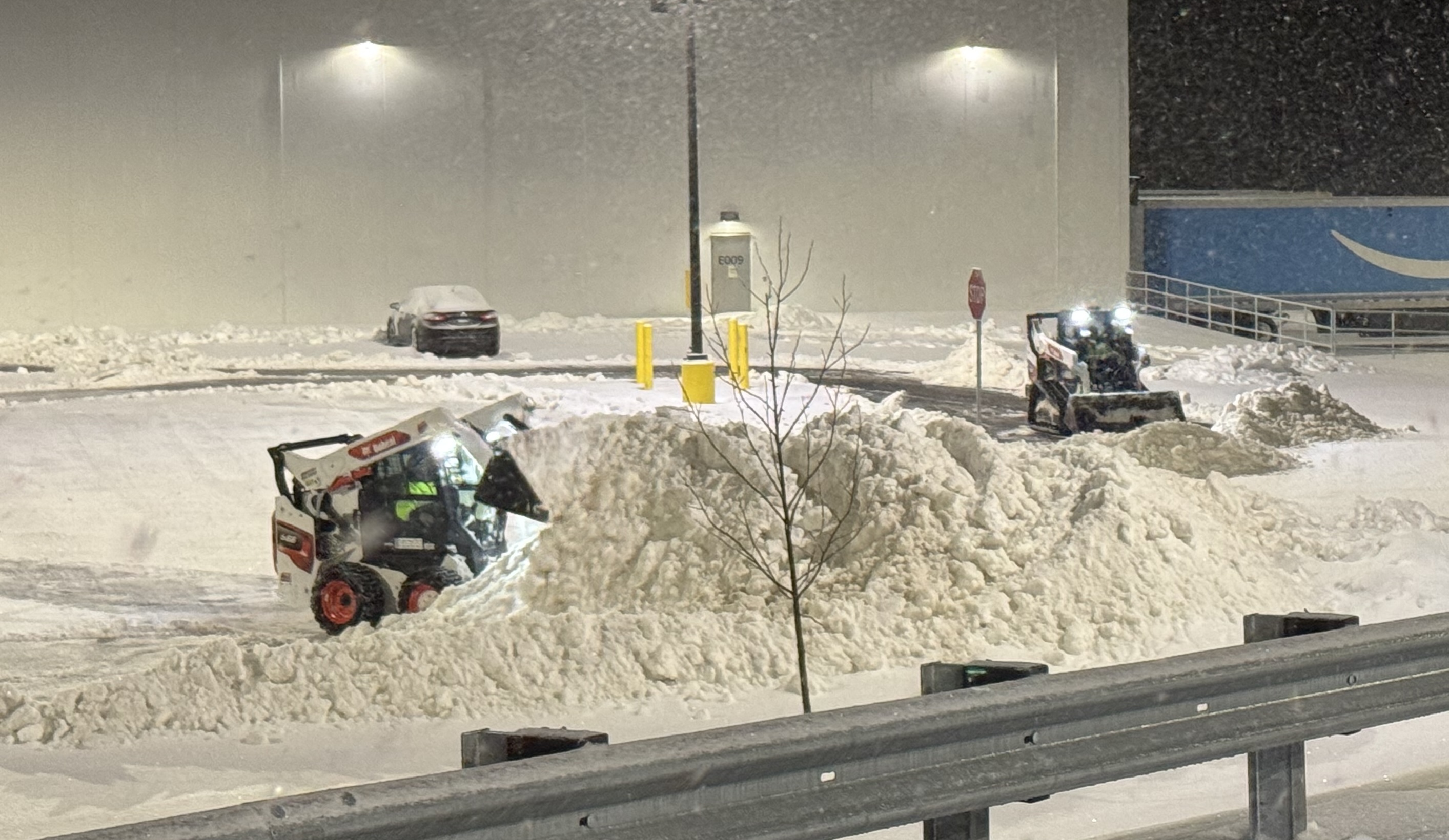 Rapid response snow removal after major winter storm clearing driveways and access roads