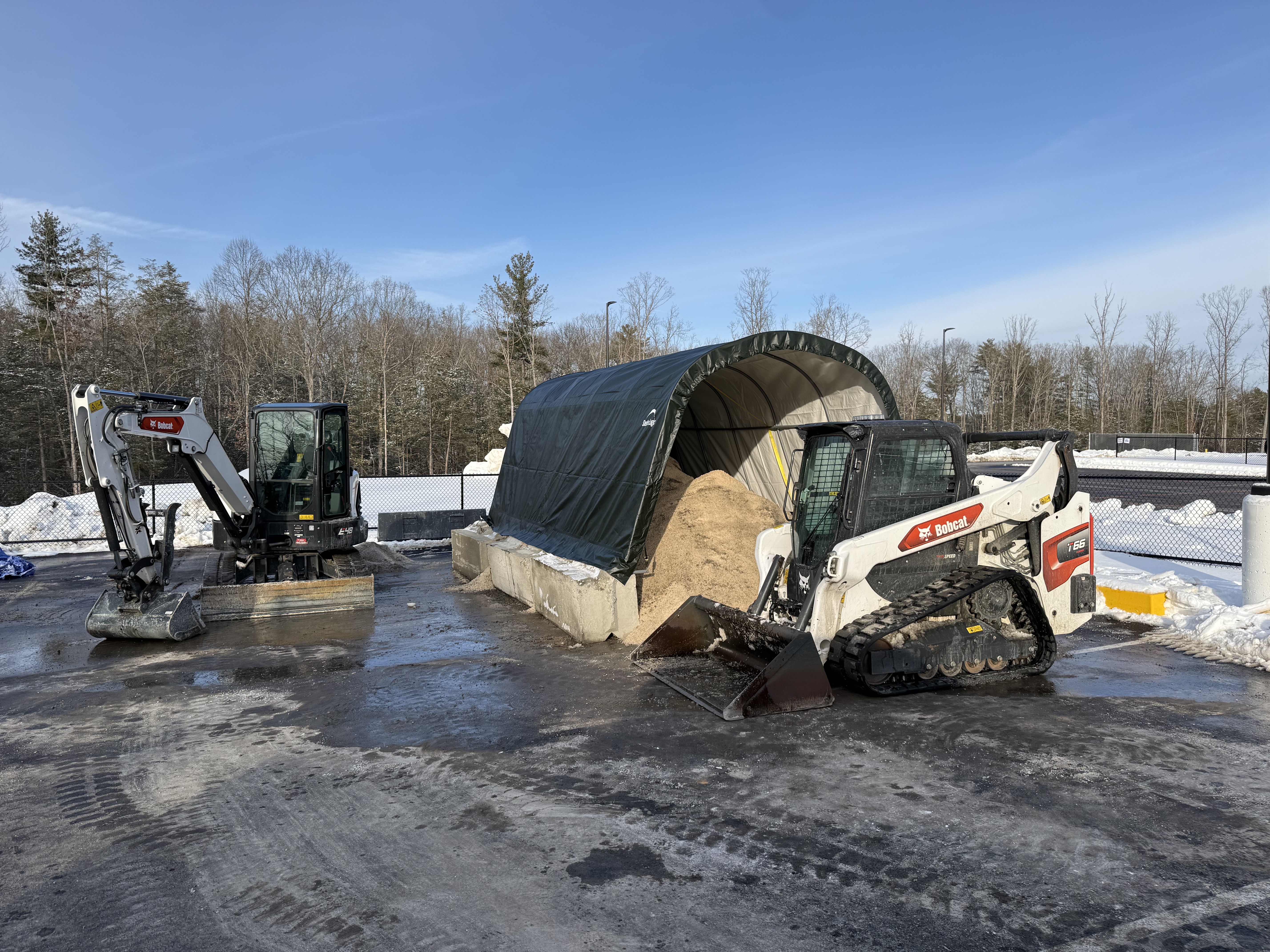 Snow removal service clearing a property during winter