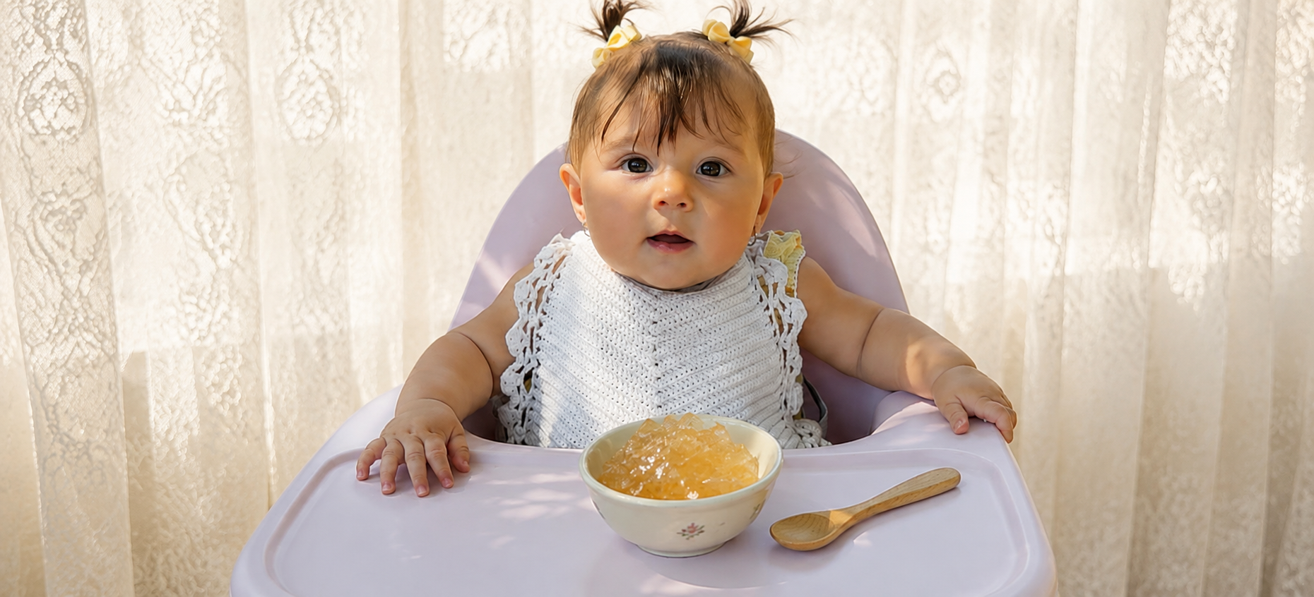 Baby eating first foods