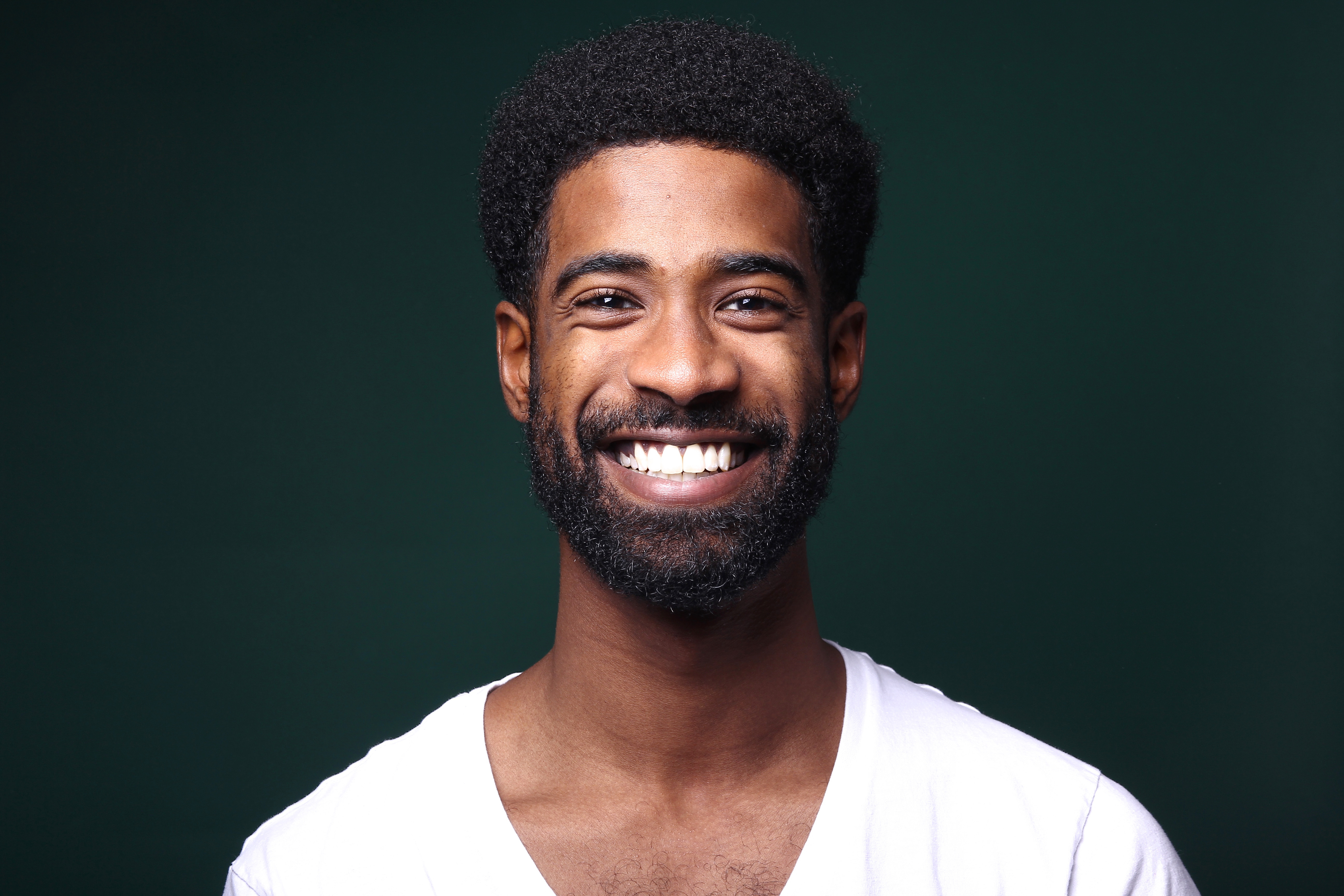Teeth whitening shade guide compared against a bright smile at Oraco Dental