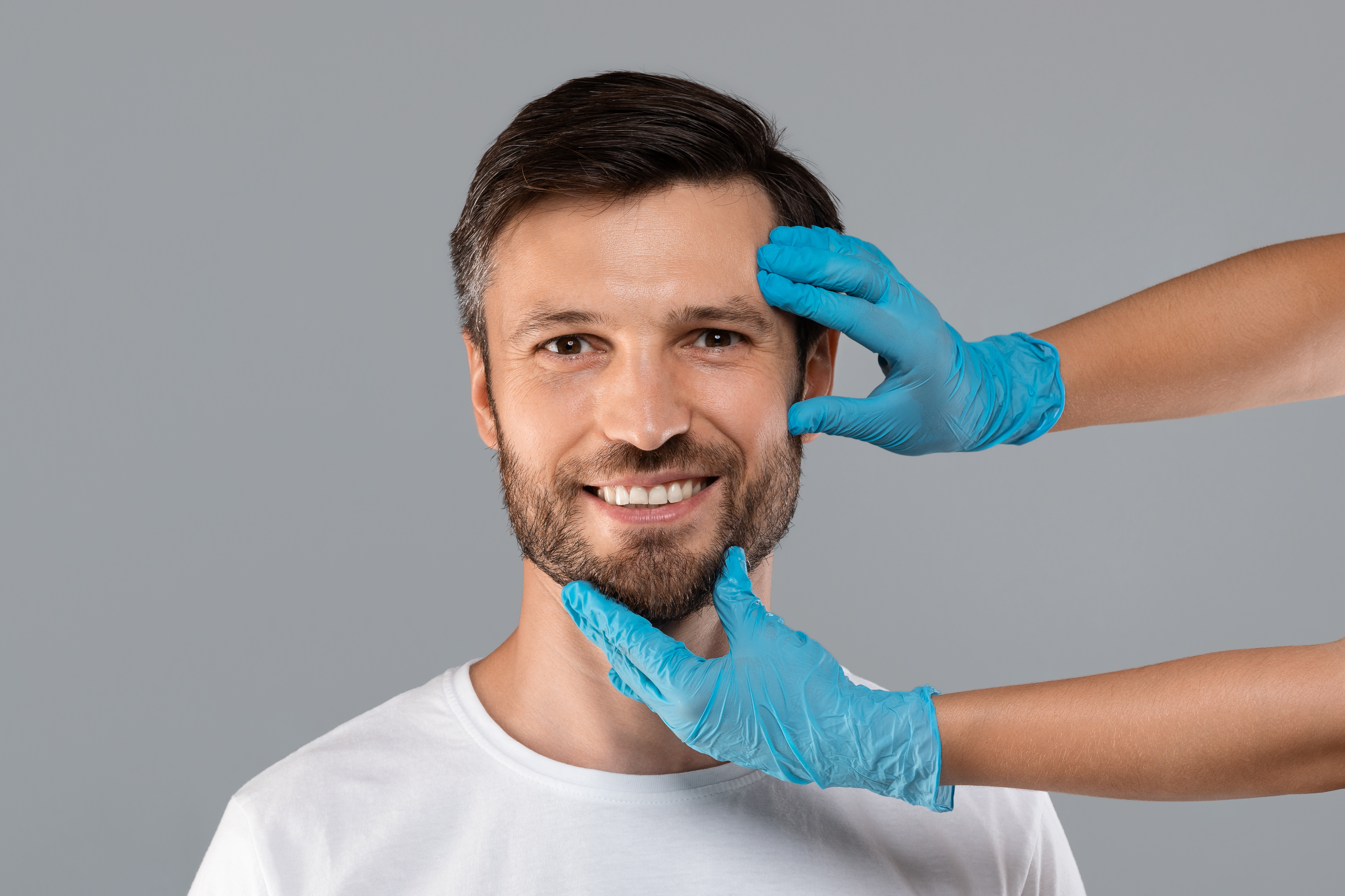 Oraco Dental clinician discussing facial aesthetics treatment options with a patient