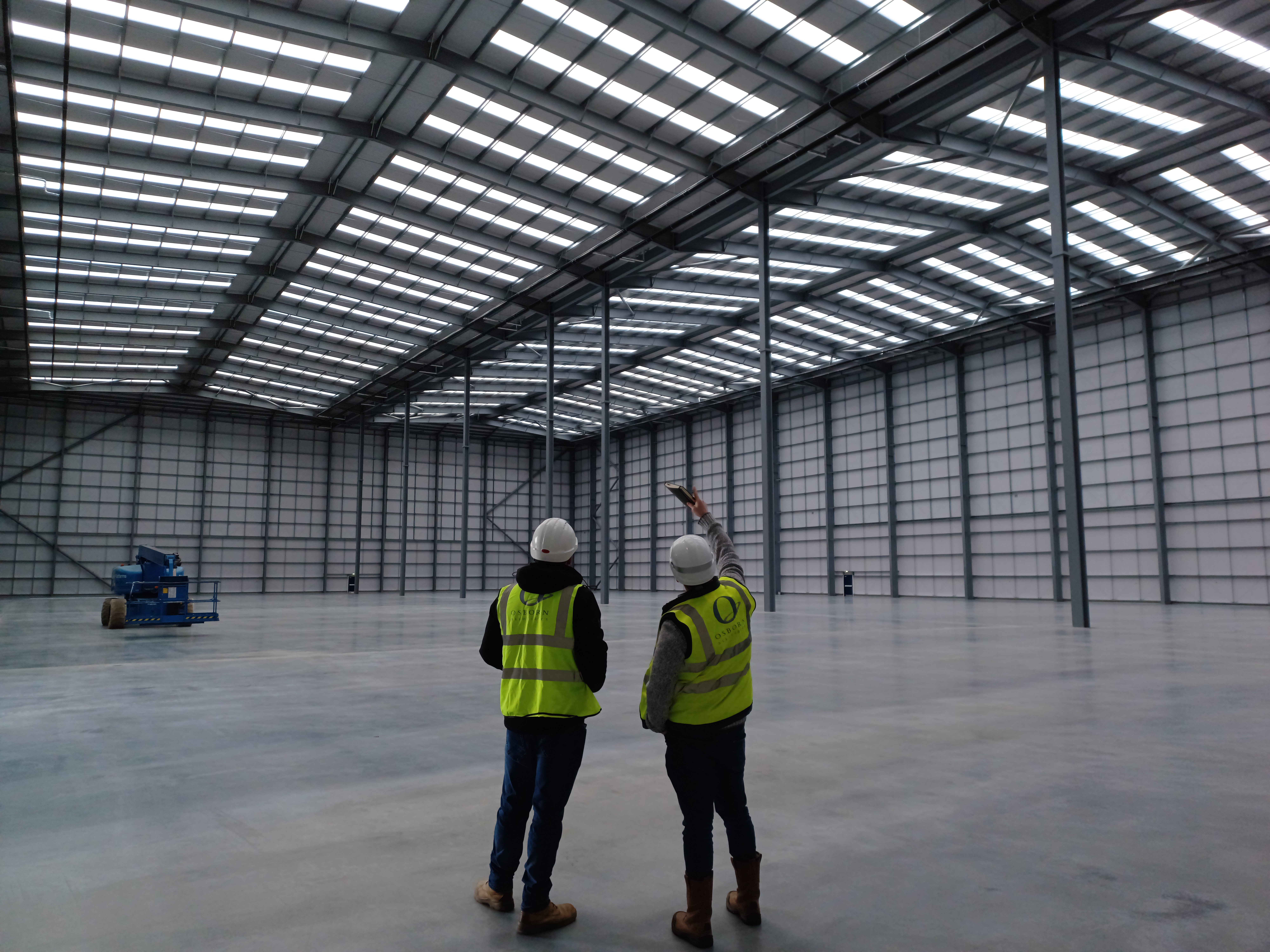 Osborn Associates engineers reviewing building infrastructure on site