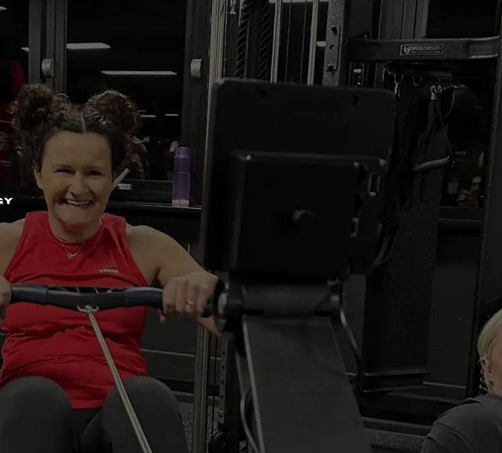 JST MVE member on the rower at HYROX