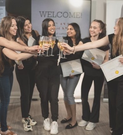 Graduates celebrating with certificates