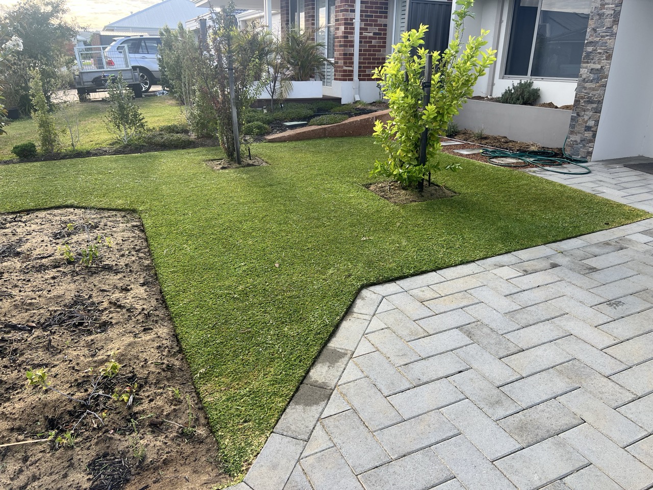 A well-maintained green lawn cared for by Cotton's Mowing