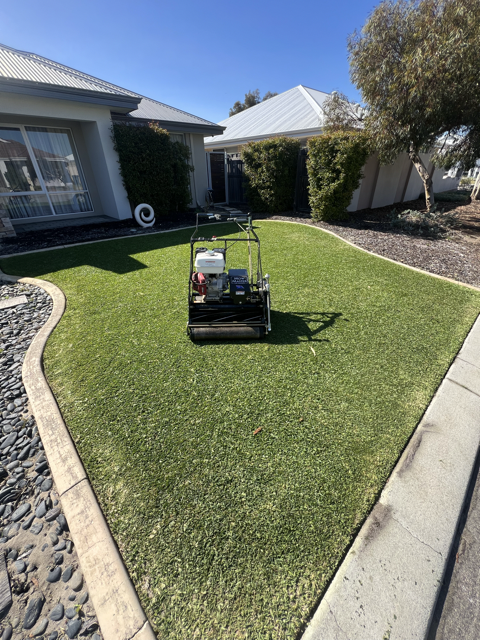 A well-maintained lawn cared for on a regular schedule by Cotton's Mowing