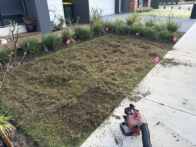 Cotton's Mowing renovation machinery working on a lawn