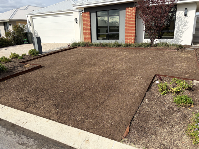 A level lawn surface after top dressing by Cotton's Mowing