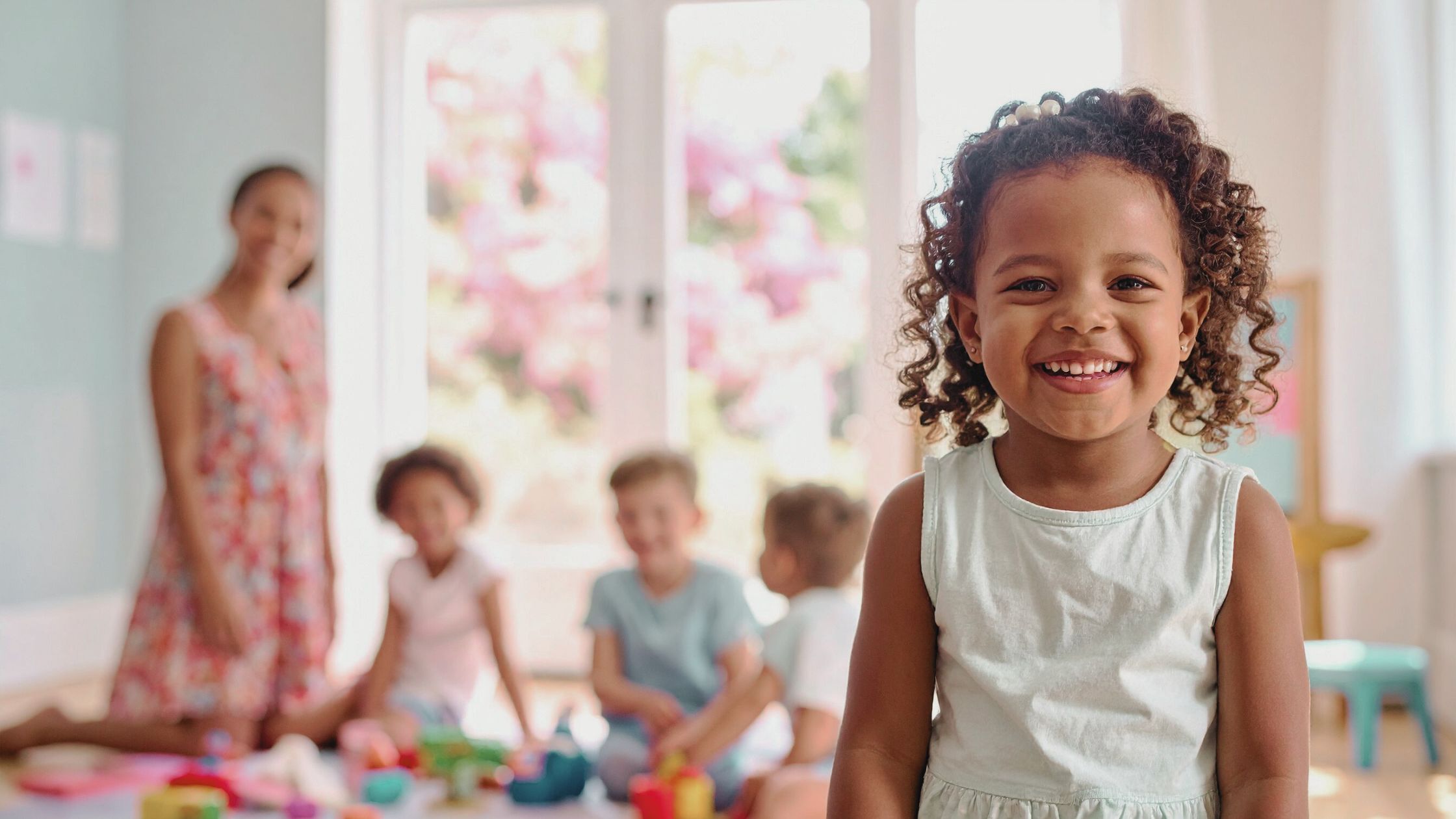 Preschooler smiling at the camera directly