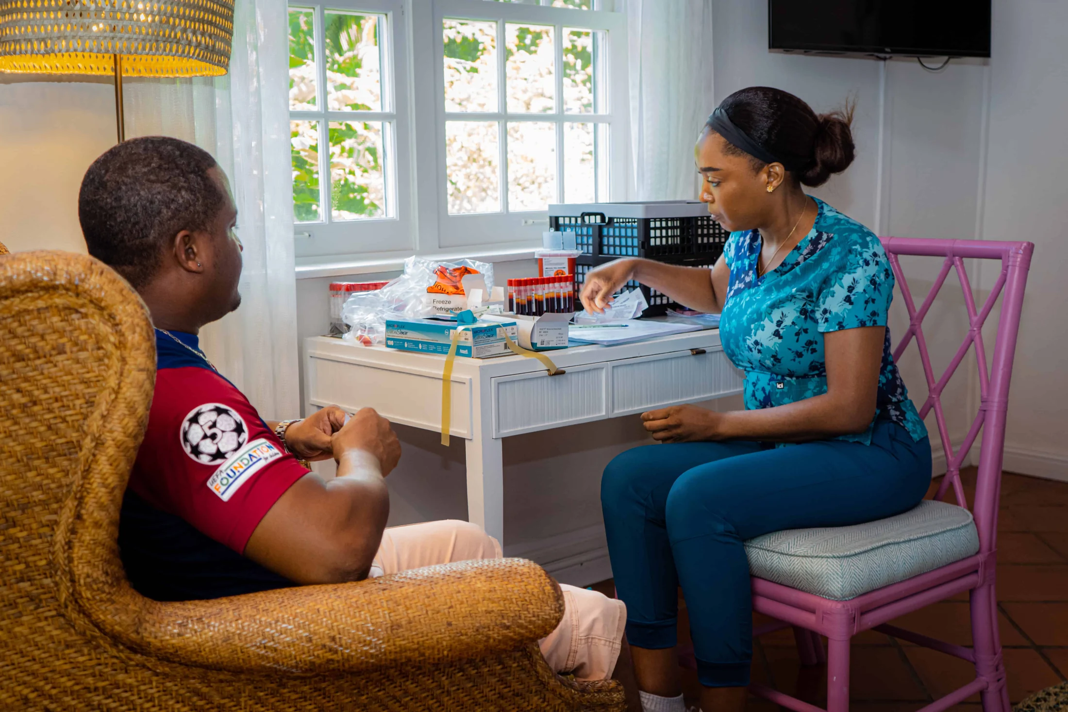 A nurse carries out a health check