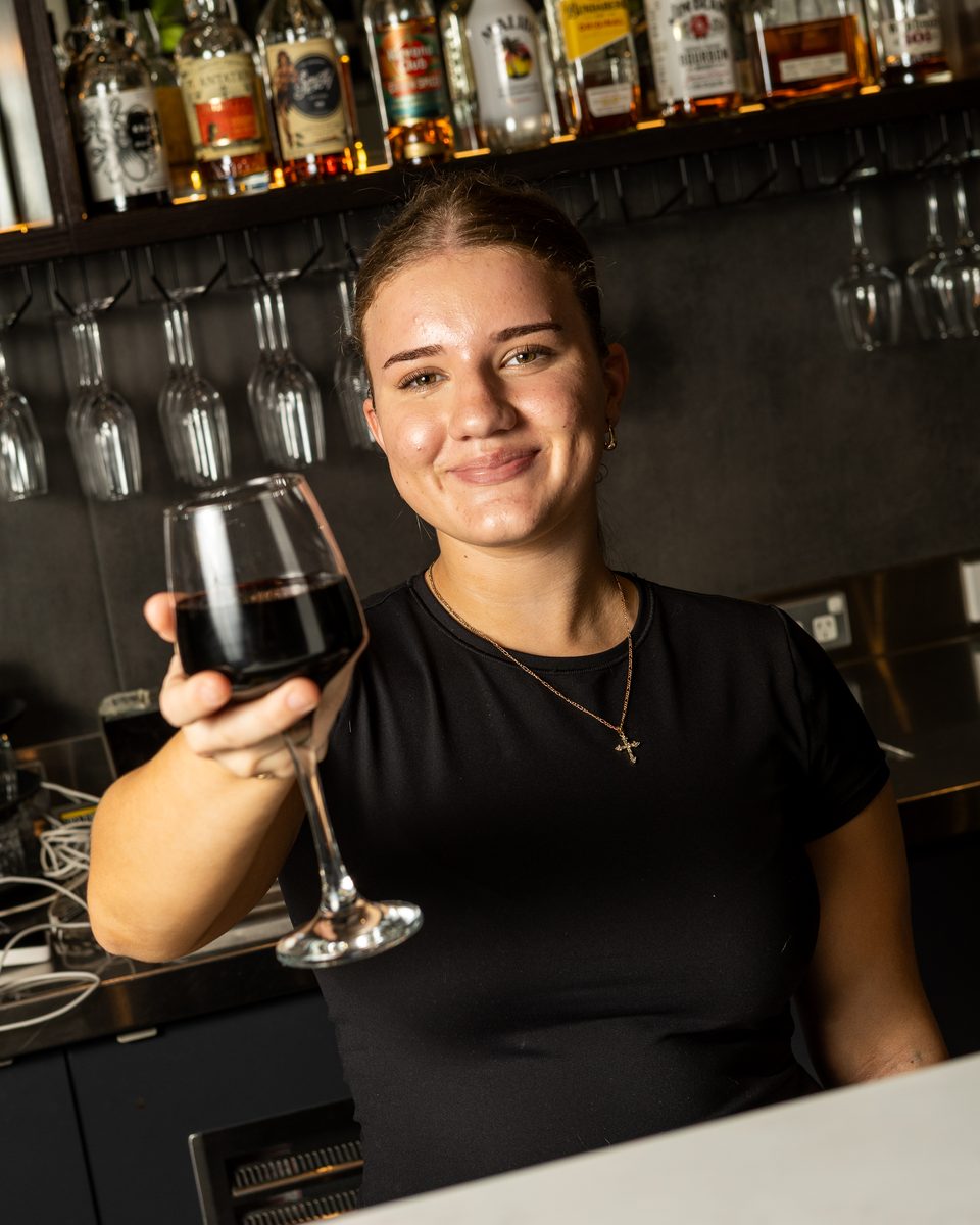 A glass of Glass House Red at the Rocky's Italian bar