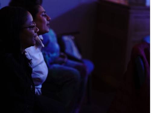 Audience members smiling during a Fun Friday Live show