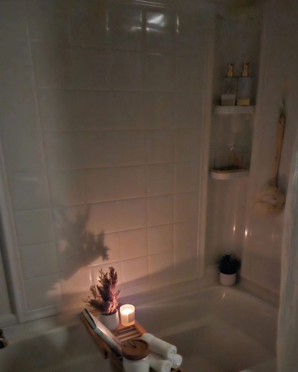 Before: a dim, cluttered bathtub area