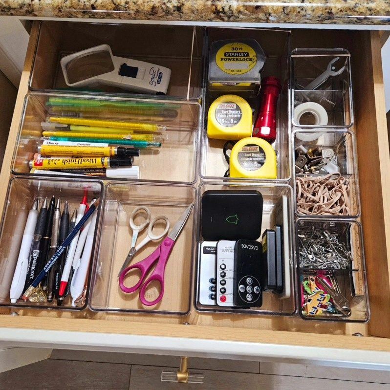 After: the drawer organized with clear dividers