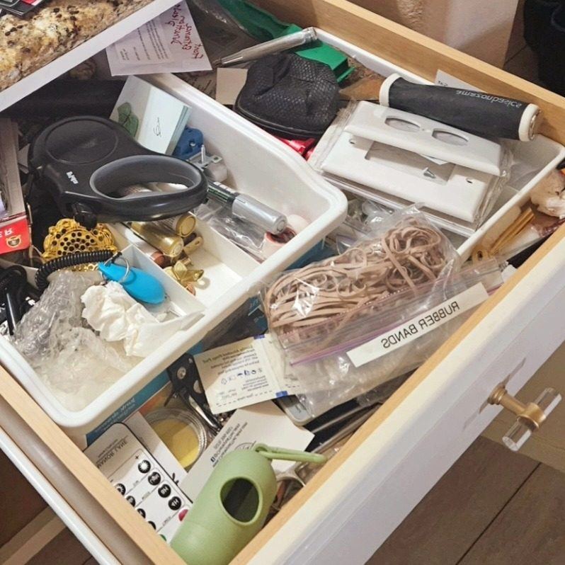 Before: a cluttered junk drawer