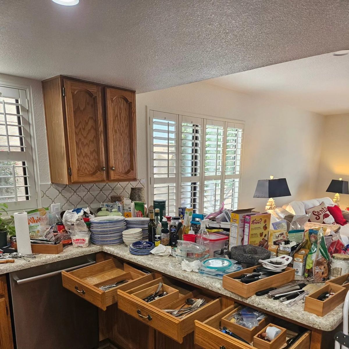 Before: kitchen counters covered in clutter