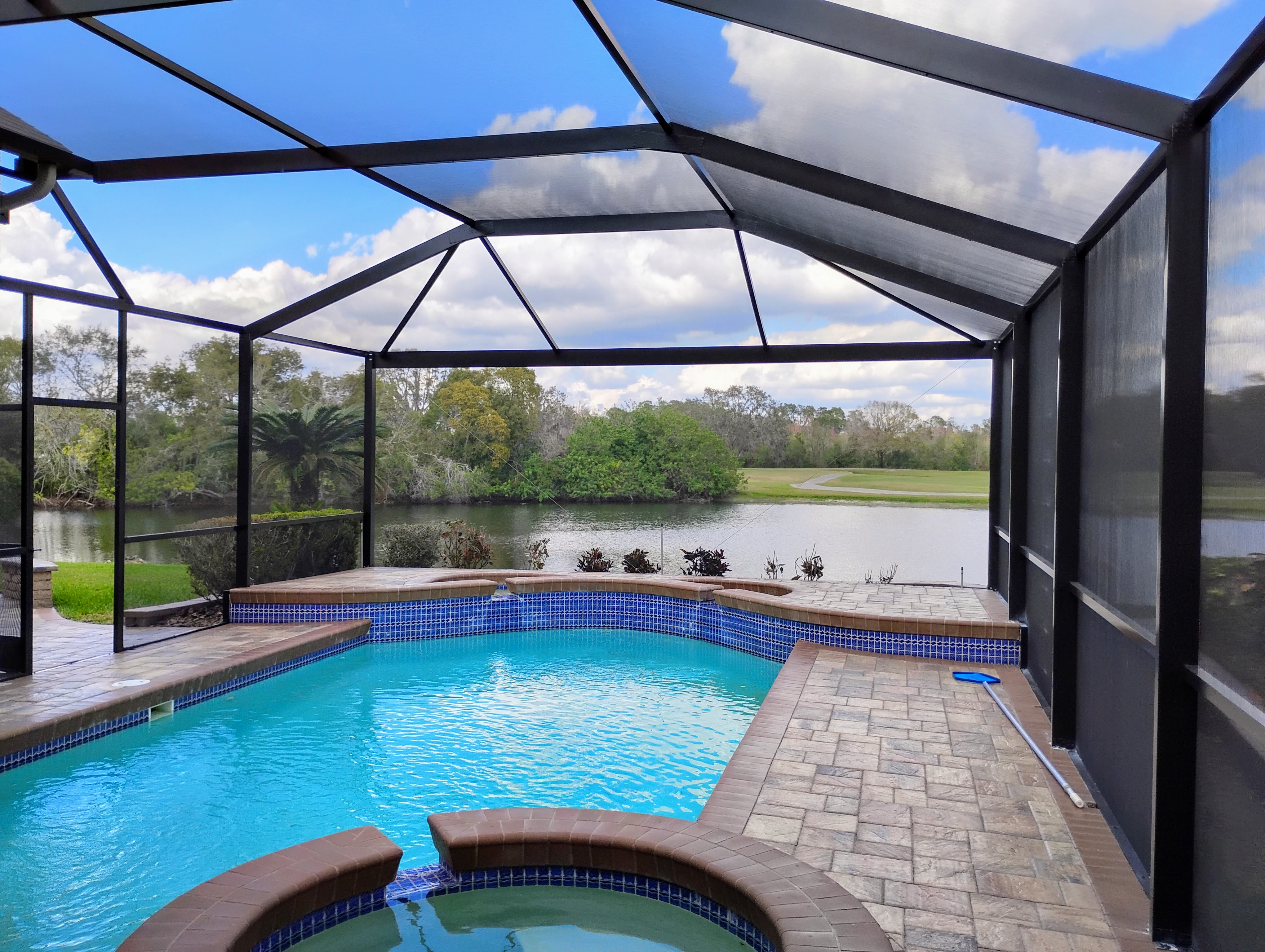 Custom pool cage enclosure installed in Tampa Bay, FL by Screen Boss