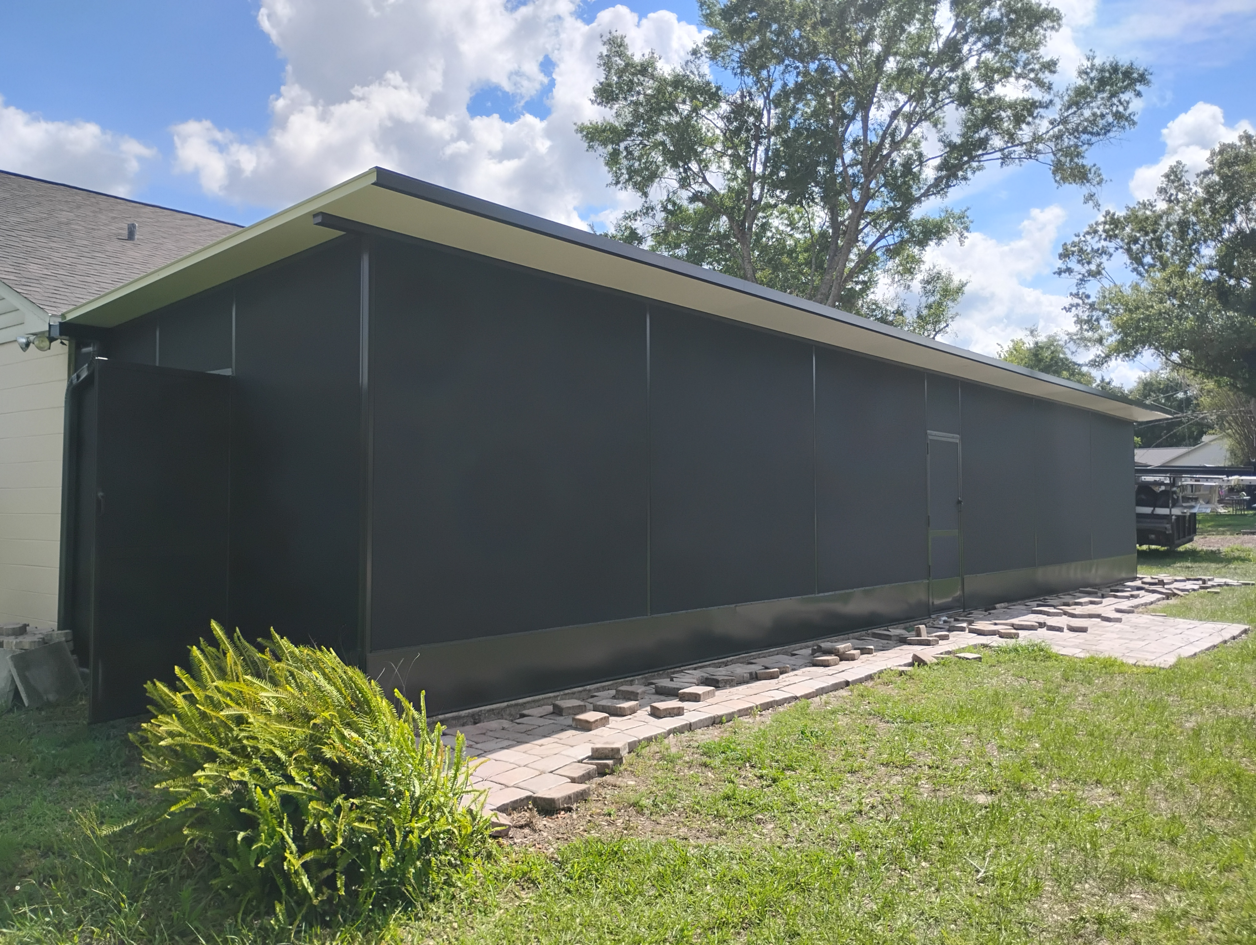 Solid composite roof enclosure built in Tampa, FL by Screen Boss
