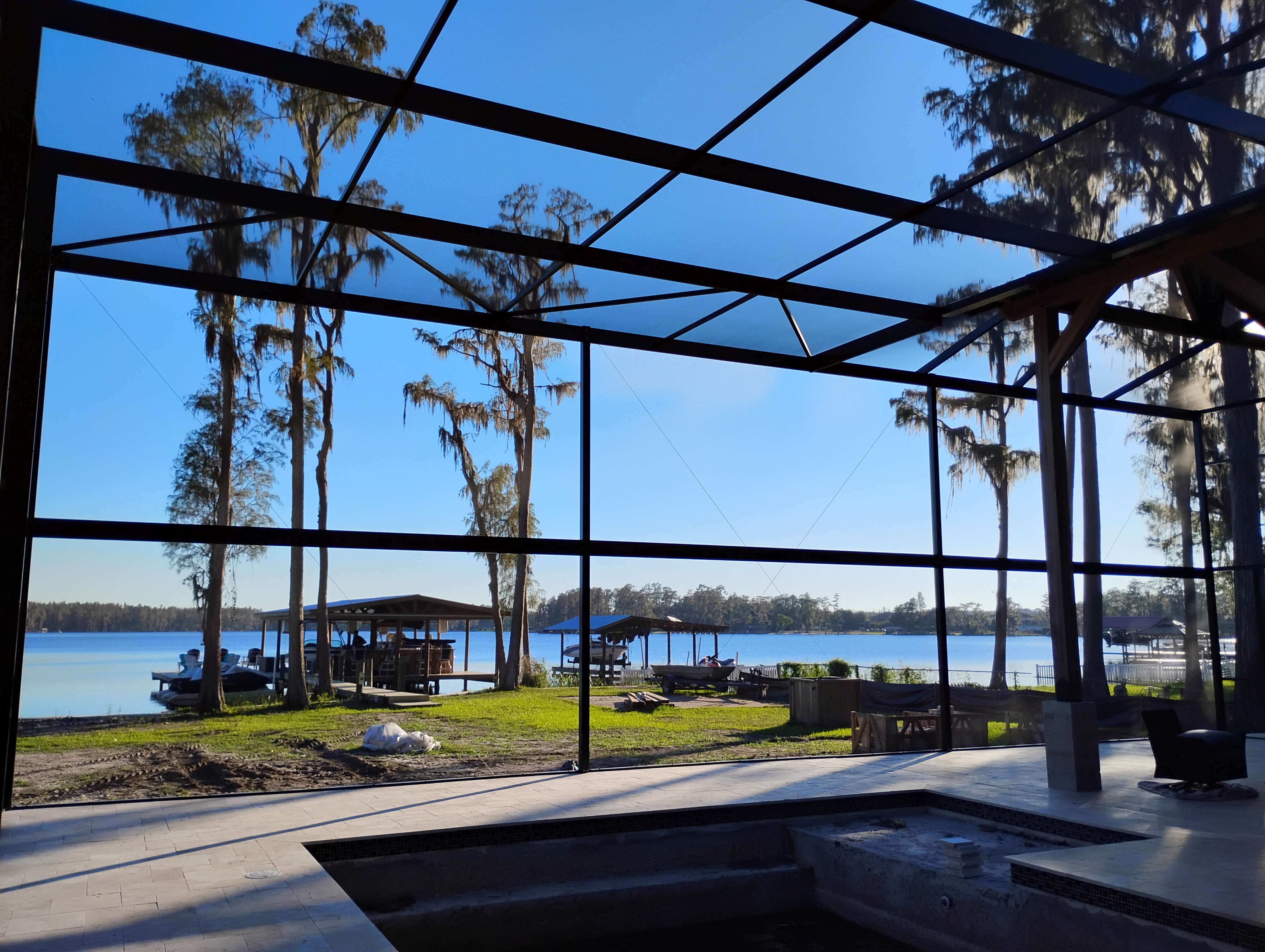 Luxury two-story pool cage enclosure built in Odessa, FL by Screen Boss