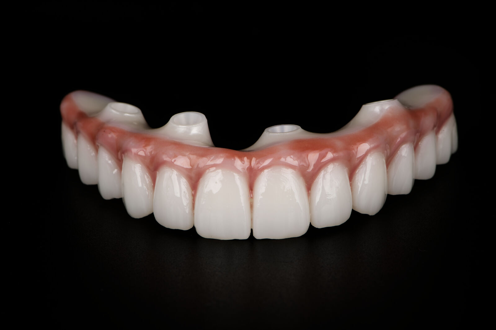 A finished Elite Dentistry zirconia full arch, front view