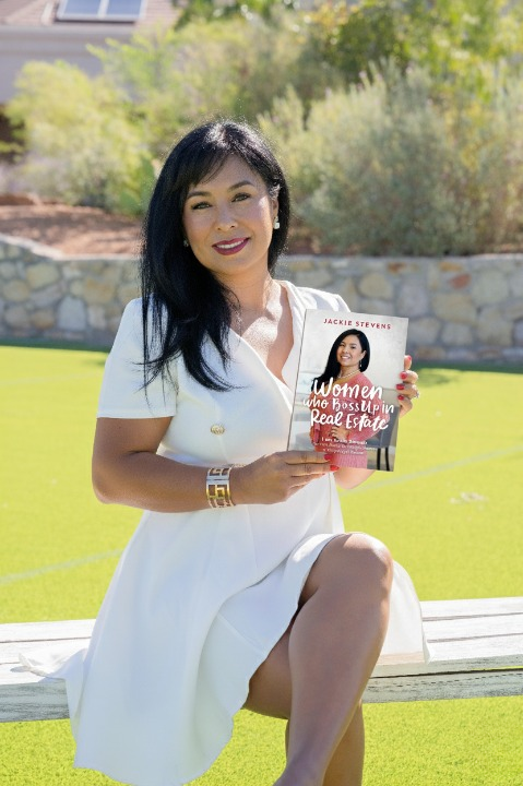 Portrait of Maya Rivers holding 'Bloom & Rise' book, confident, modern editorial style.