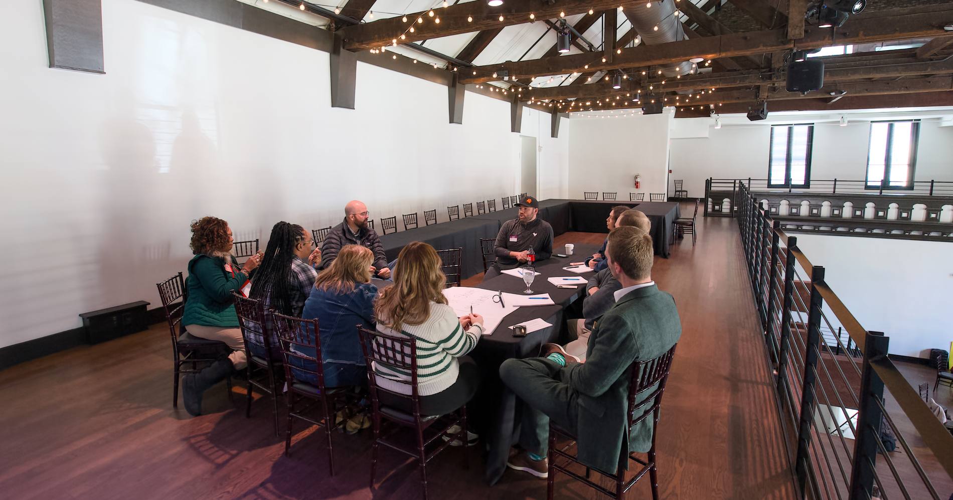 The full room set with round tables during a session