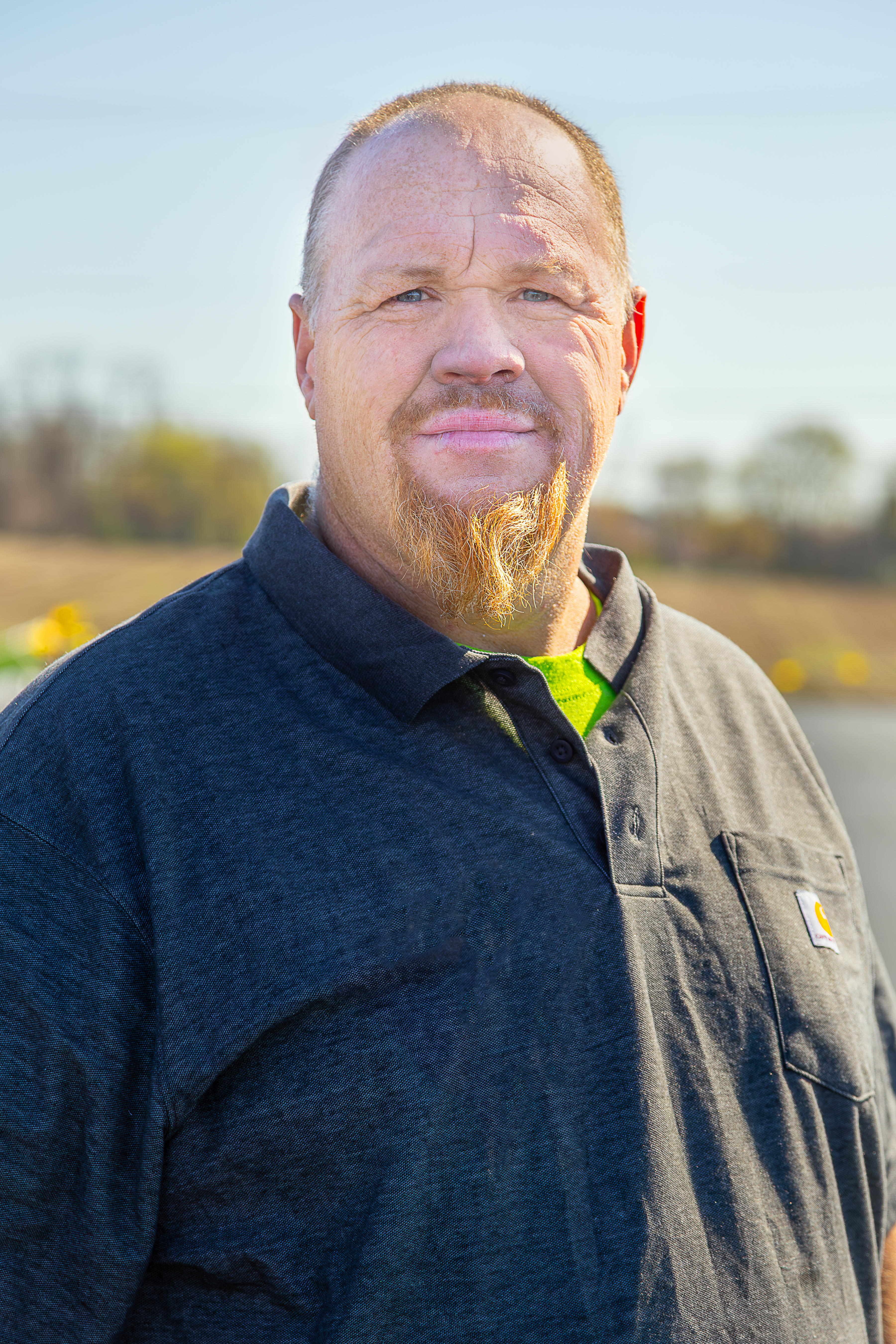 A professional roofing contractor from Schultz Roofing, Inc. stands confidently outdoors on a clear day, representing the experienced team ready to handle your commercial and residential roofing projects. - Schultz Roofing, Inc A professional roofing contractor from Schultz Roofing, Inc. stands confidently outdoors on a clear day, representing the experienced team ready to handle your commercial and residential roofing projects. - Schultz Roofing, Inc