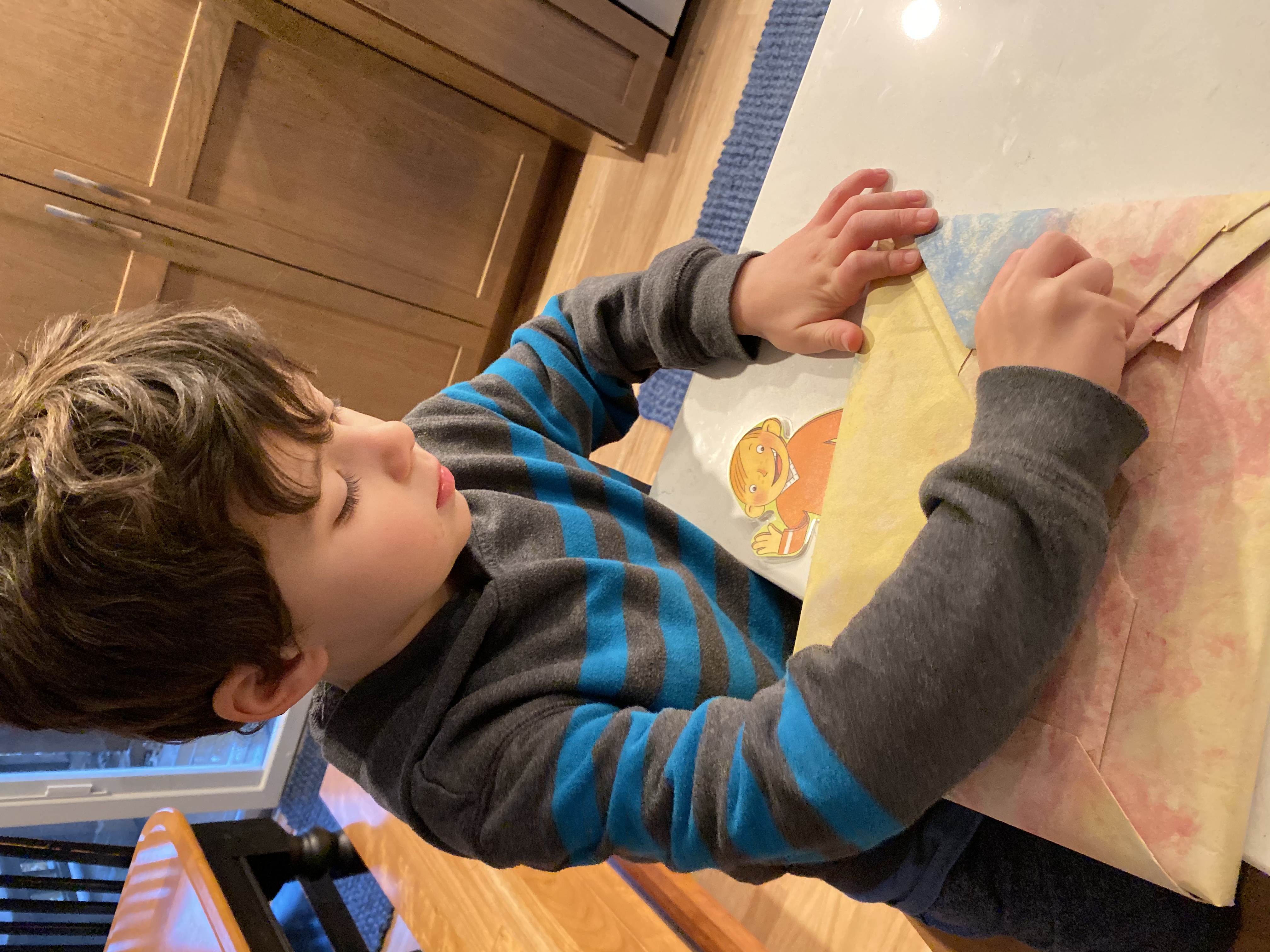 Child participating in a home-based learning activity