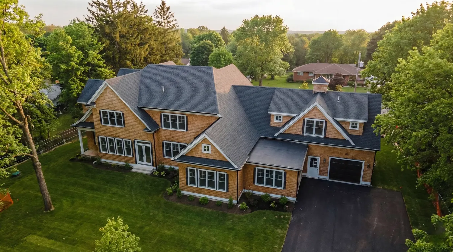 Aerial view of a completed shingle roof on a South Shore Massachusetts home
