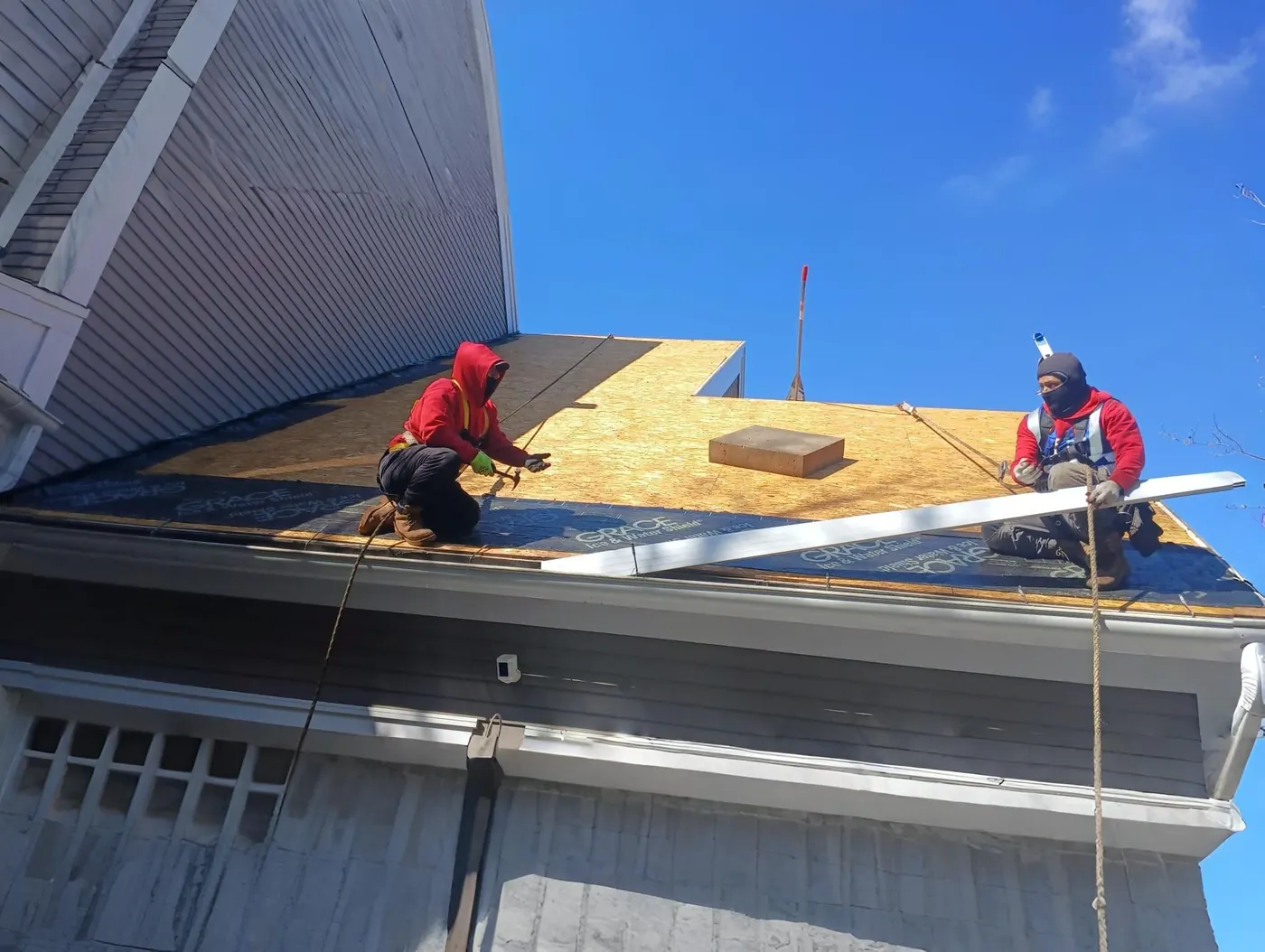 New roof decking going down during a roof replacement in Massachusetts
