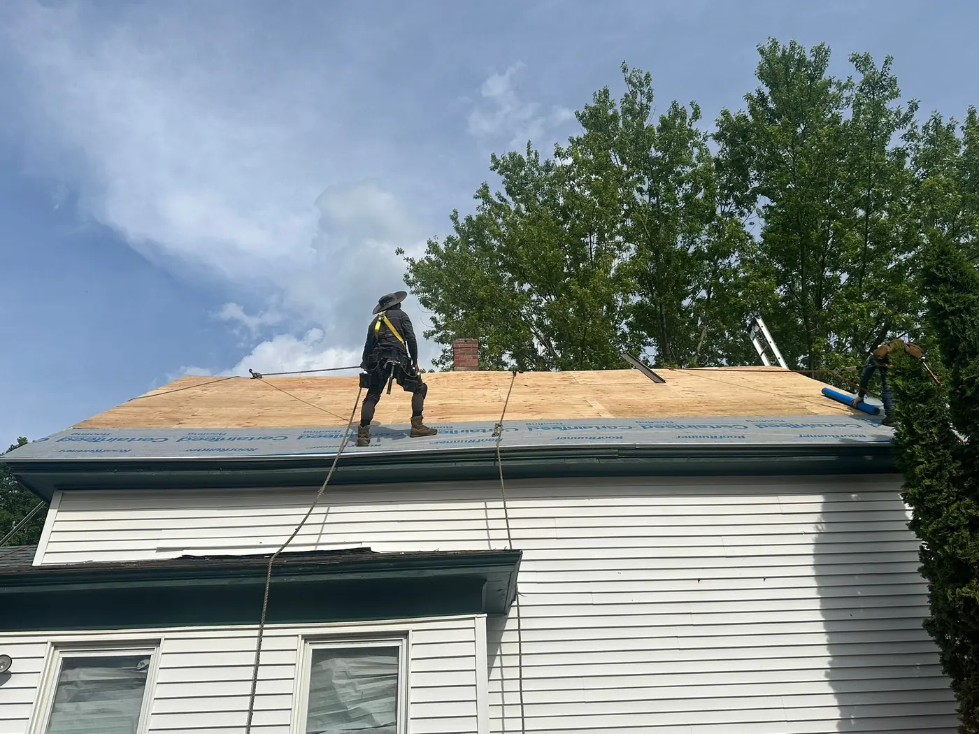 Roof tear off in progress on a South Shore Massachusetts home