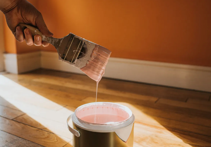 Professional painter applying a fresh coat of paint to a home interior