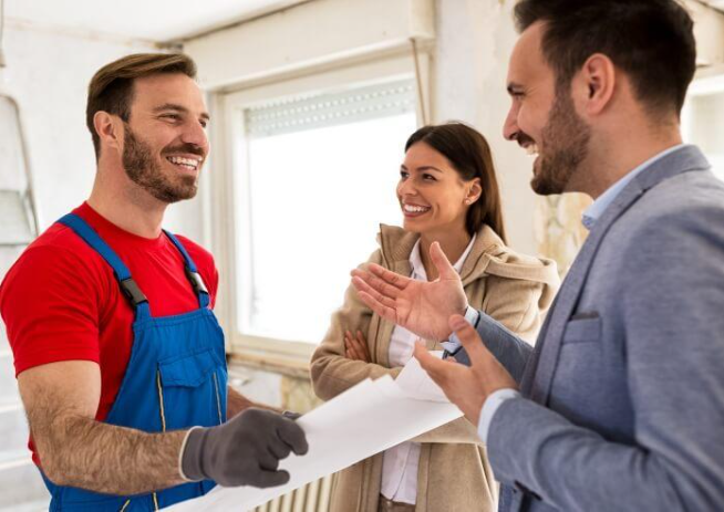 Painter consulting with homeowners during a project assessment