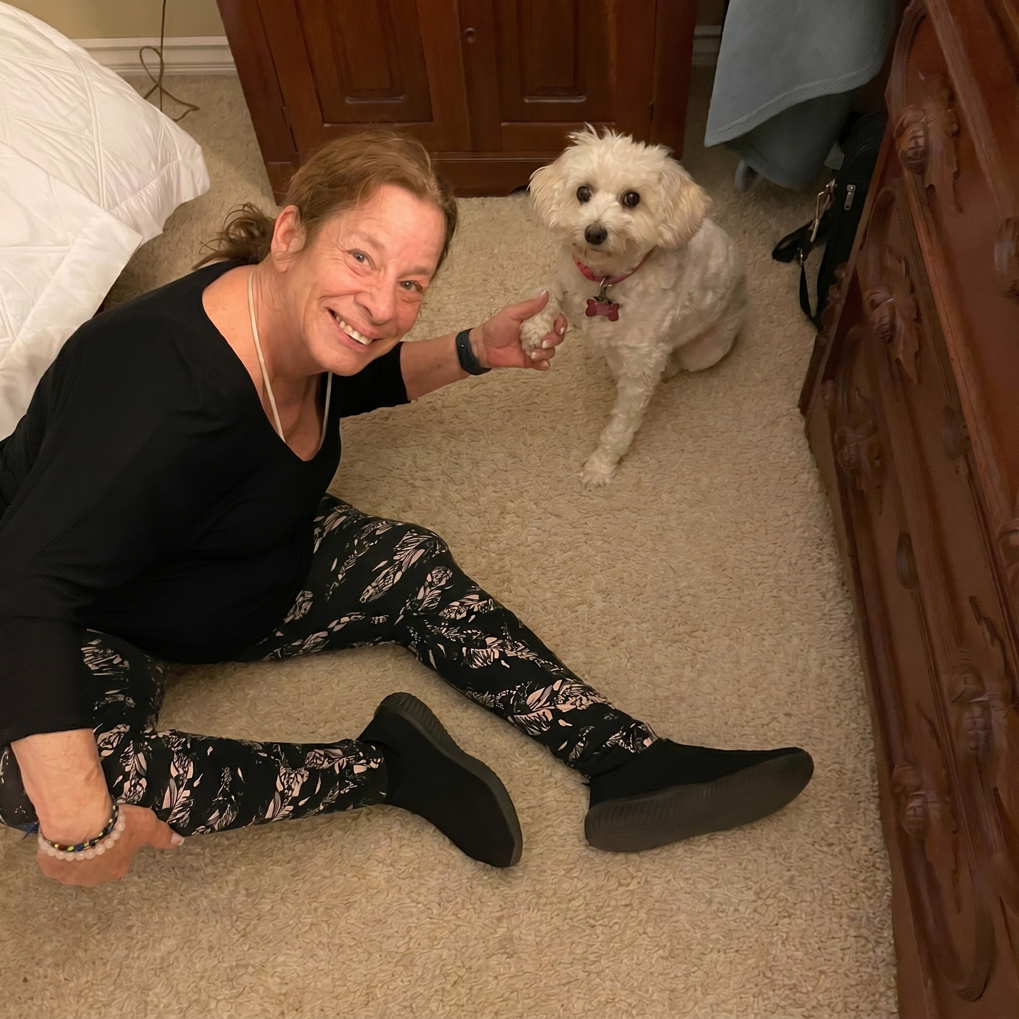 Pam Lafferman, owner of A Walk While You Work pet sitting, holding Zee the cat