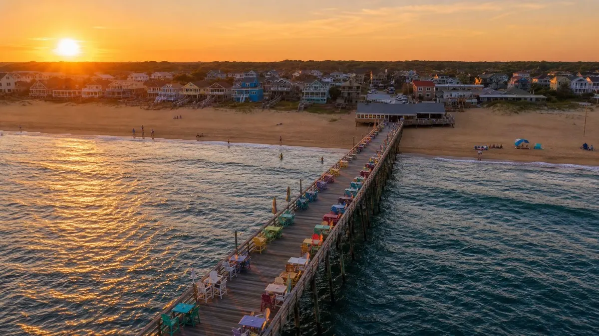 Wooden dune path leading down to the beach at sunrise on the Outer Banks