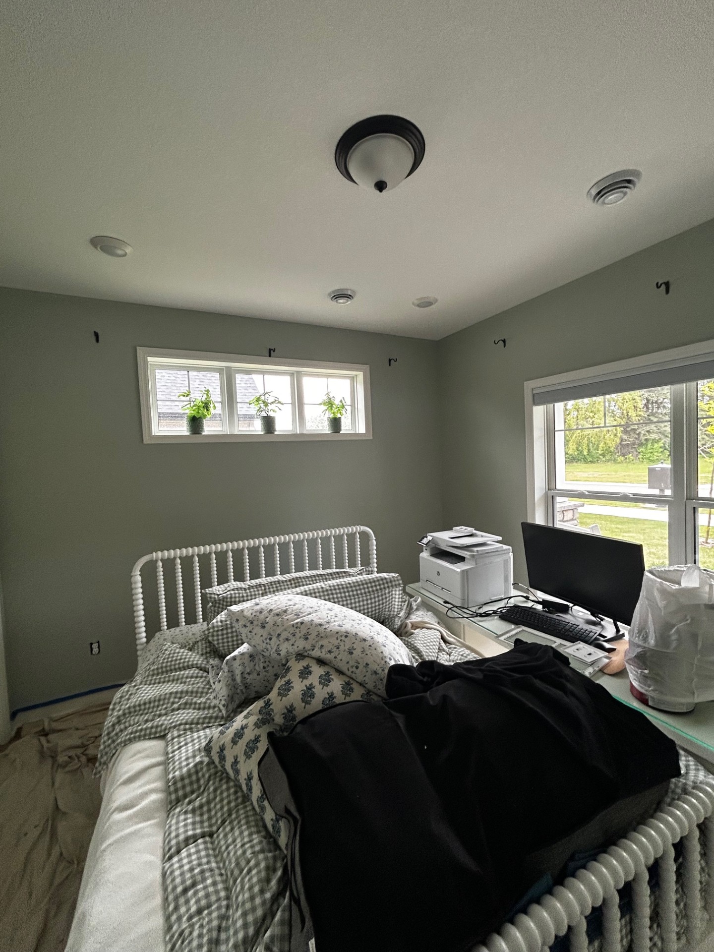 Cozy bedroom repainted in soft neutral tones