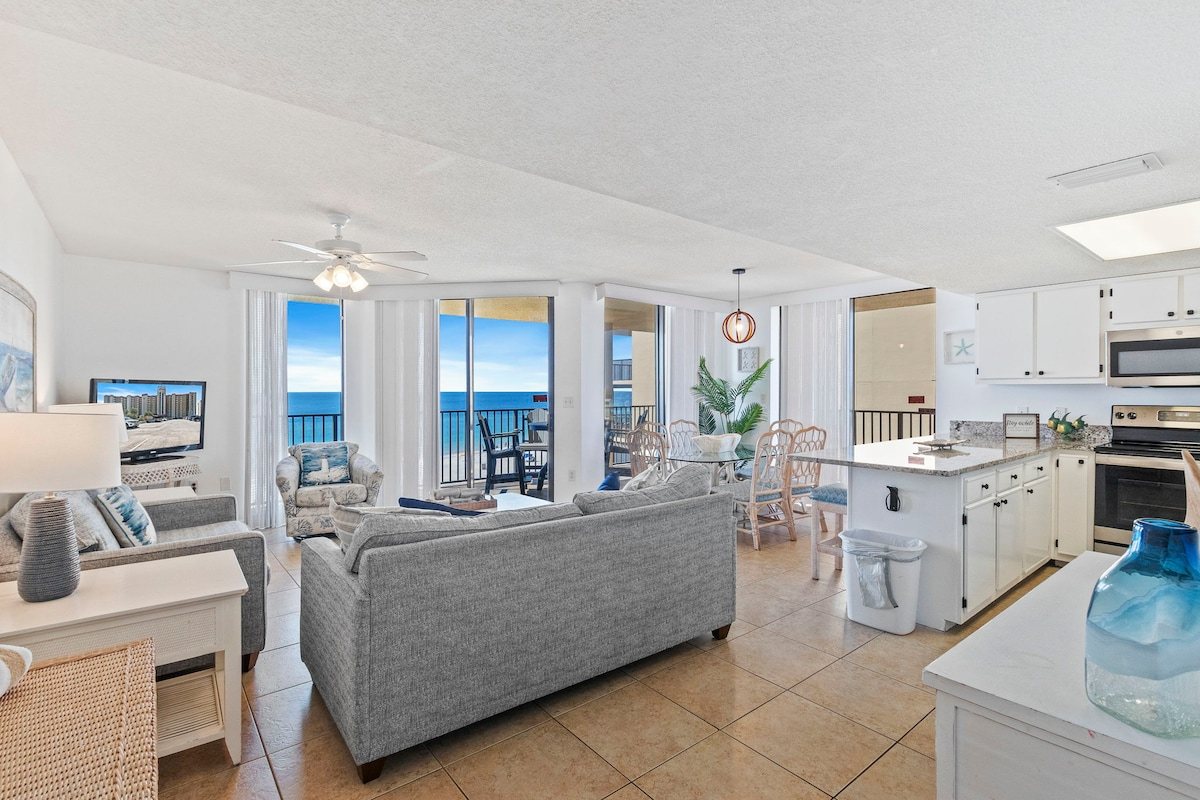 Living room with a full wall of glass facing the Gulf
