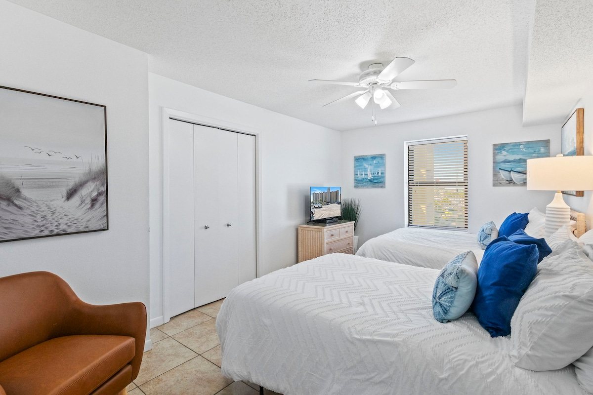 Claim a bed, drop the bag, and head for the sand