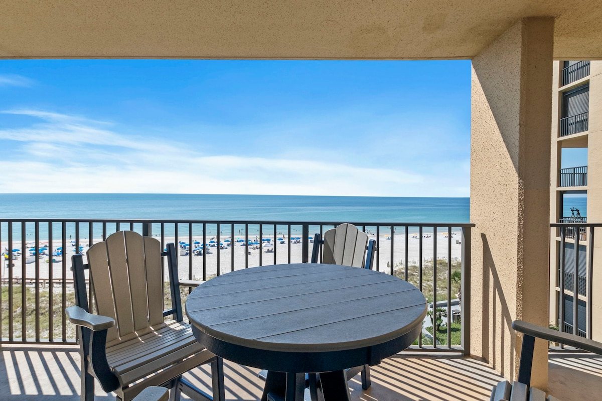 Balcony dining table for four facing the water