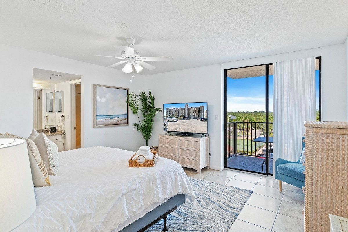 Primary bedroom with a slider opening onto the balcony