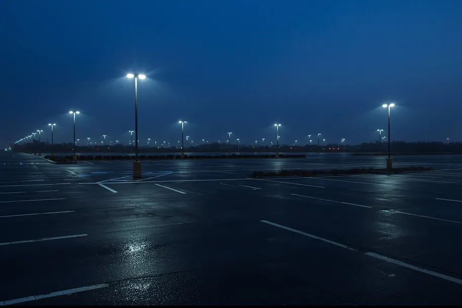 Parking lot at night lit by LED flood lights for bright, even illumination and safety