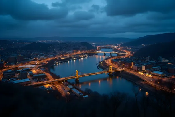 Pittsburgh skyline and yellow bridges at blue hour, LED lit warehouses, industrial high bay and flood lighting service area