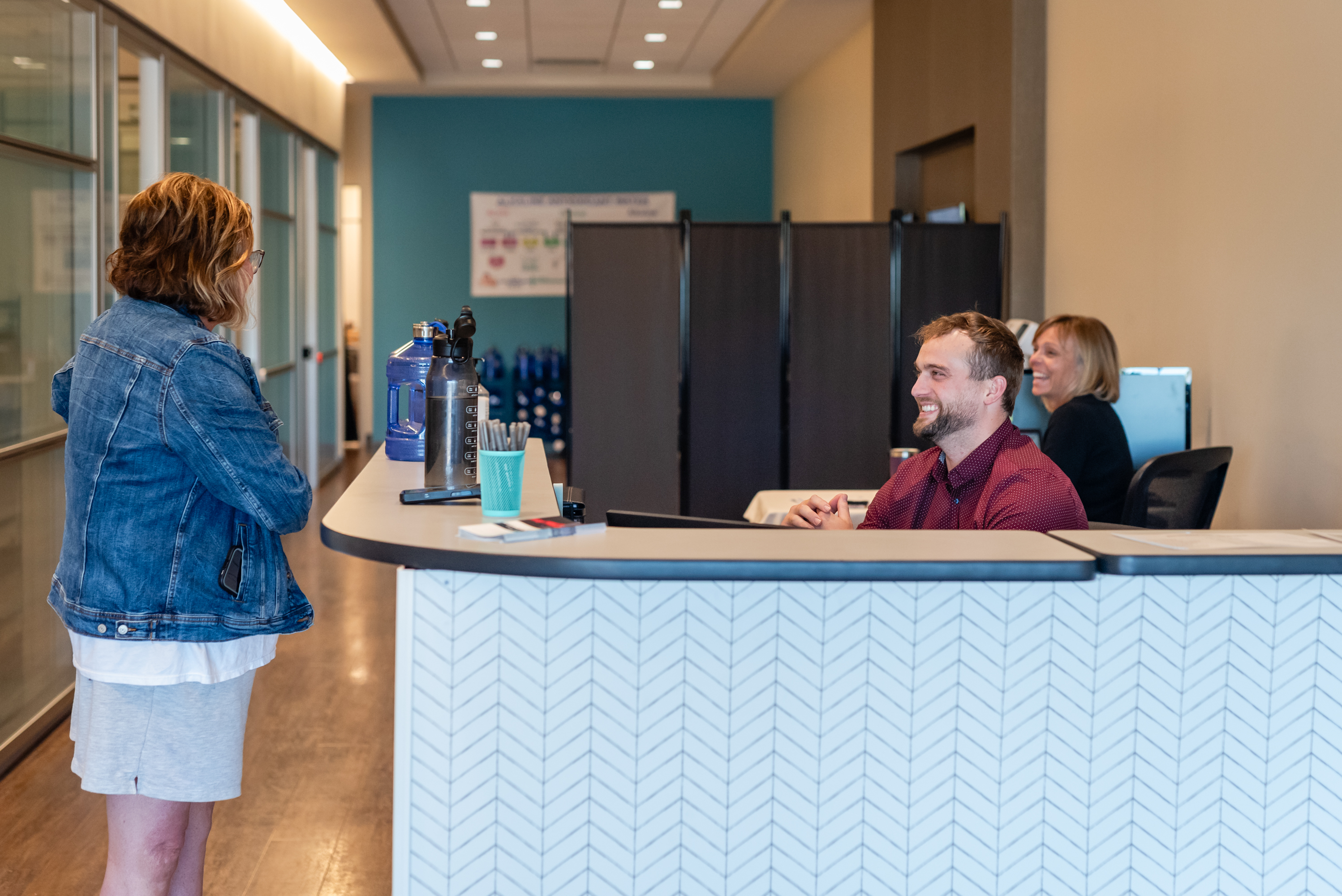 front desk smiling with a patient