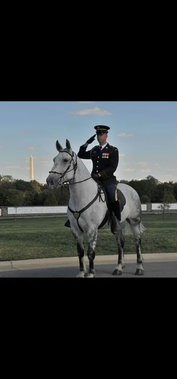 Mike Poarch in dress uniform on horseback during his eight years in the Army