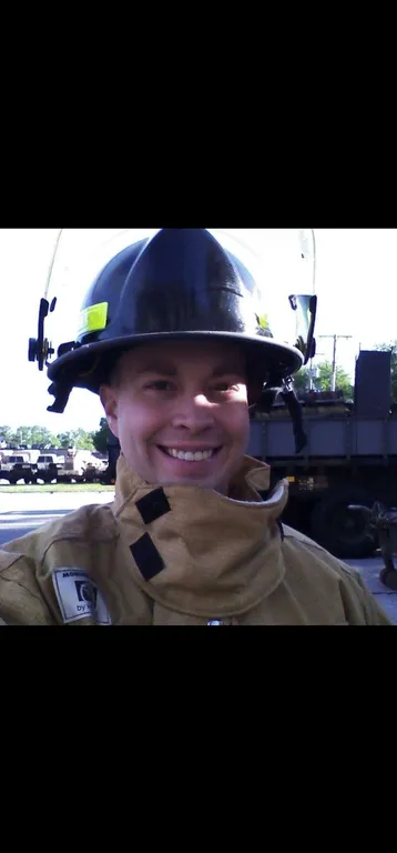 Mike Poarch in firefighter turnout gear during his six years fire fighting