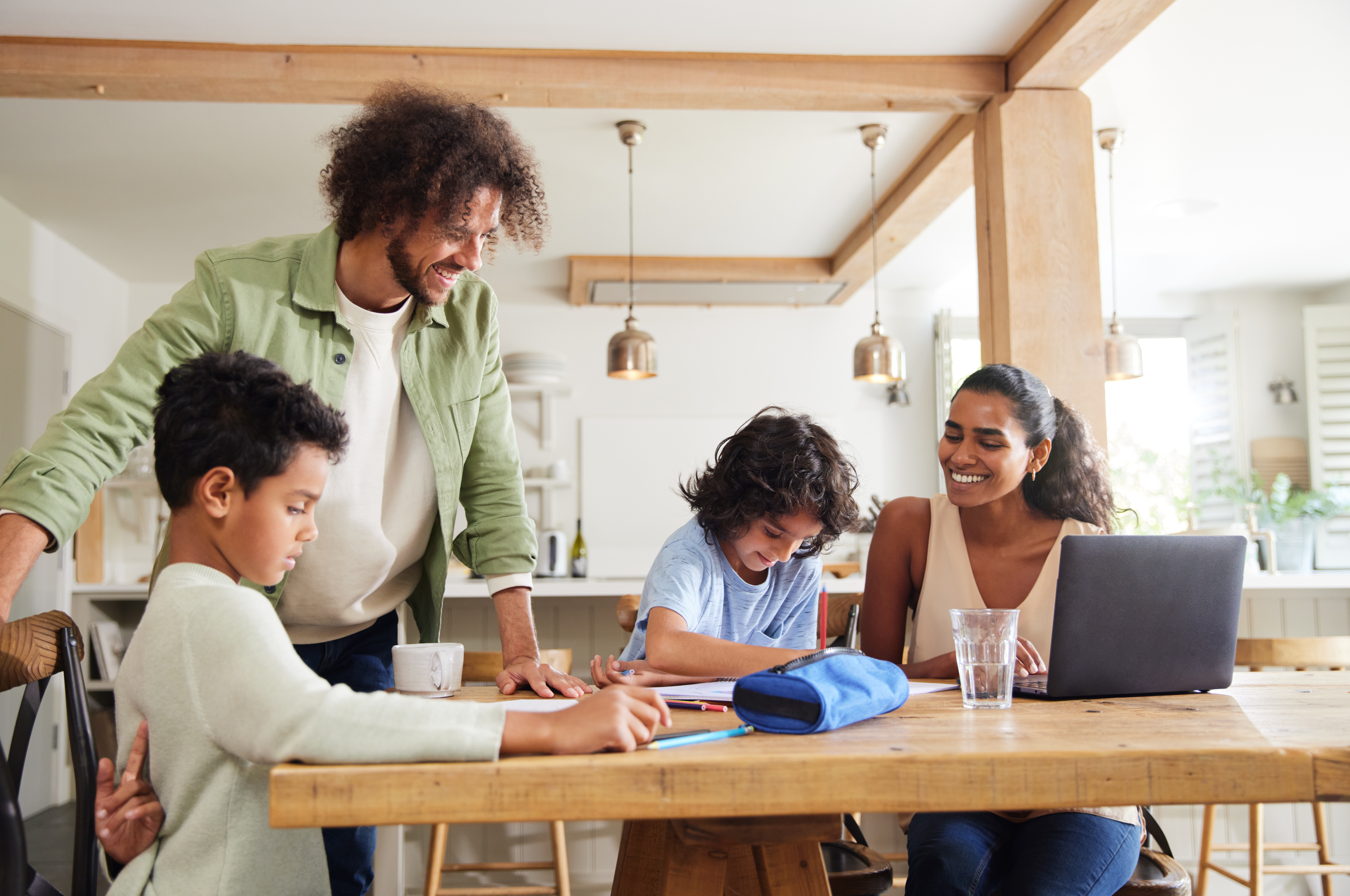 Parent and teenager learning together at home