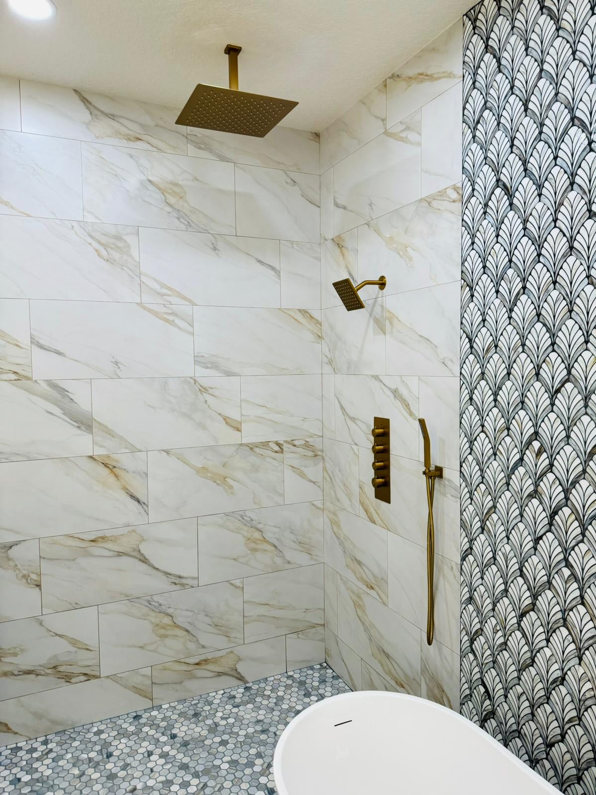 Finished bathroom remodel by Power to Build Construction LLC