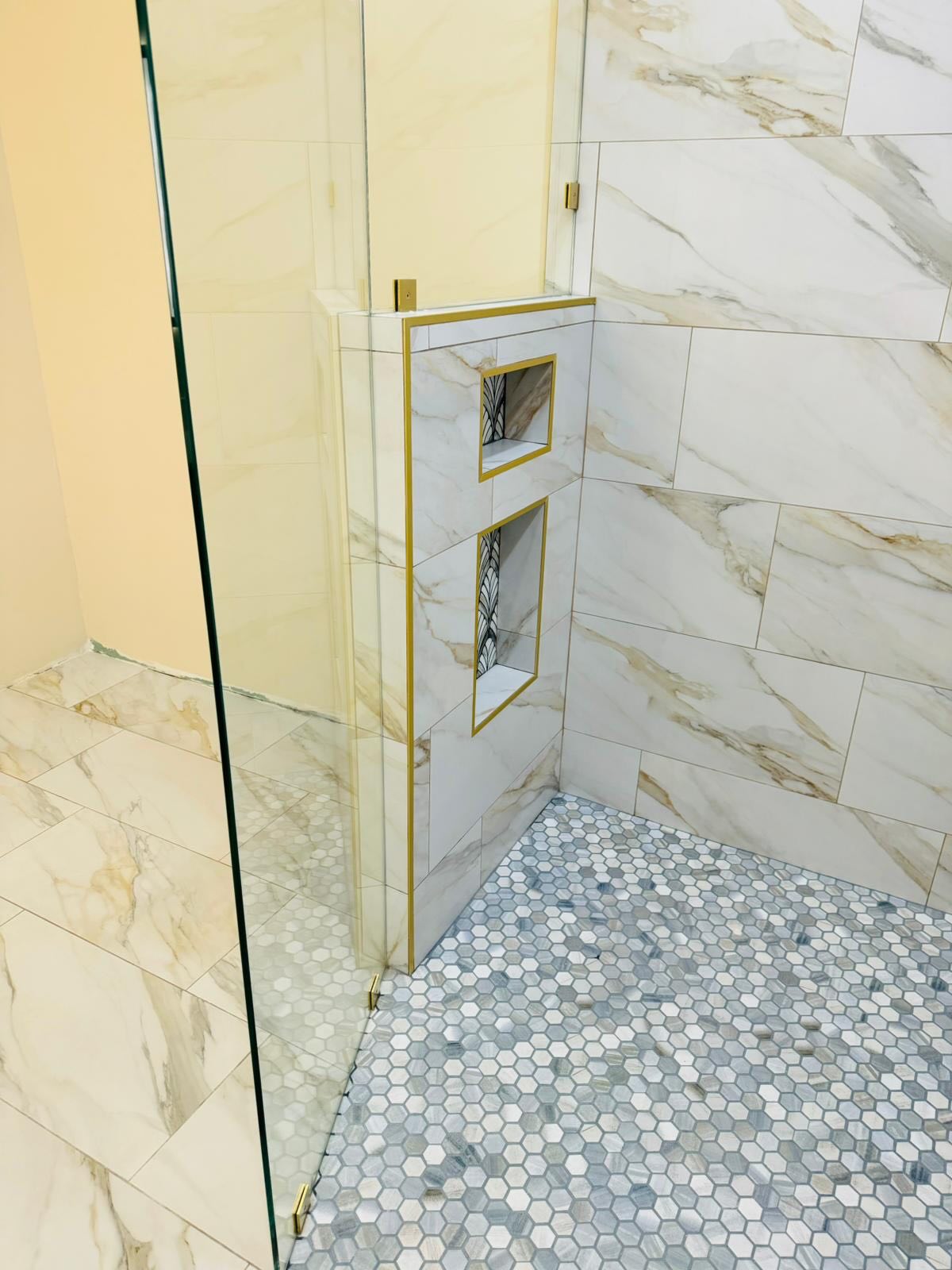 Finished bathroom remodel by Power to Build Construction LLC